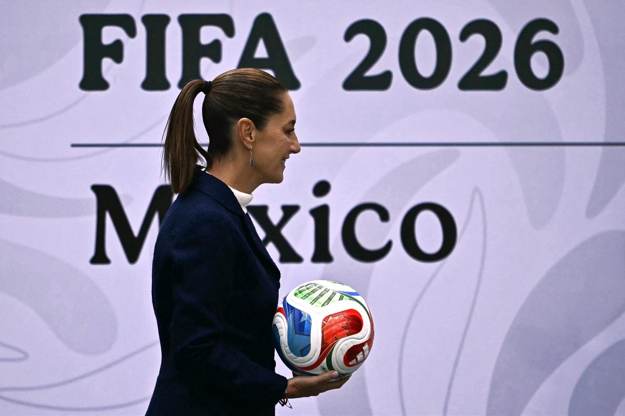 Mexican President Claudia Sheinbaum displays an official FIFA World Cup 2026 ball during a presentation of the tournament’s organization plans in Mexico City, November 10, 2025. (AFP Photo)