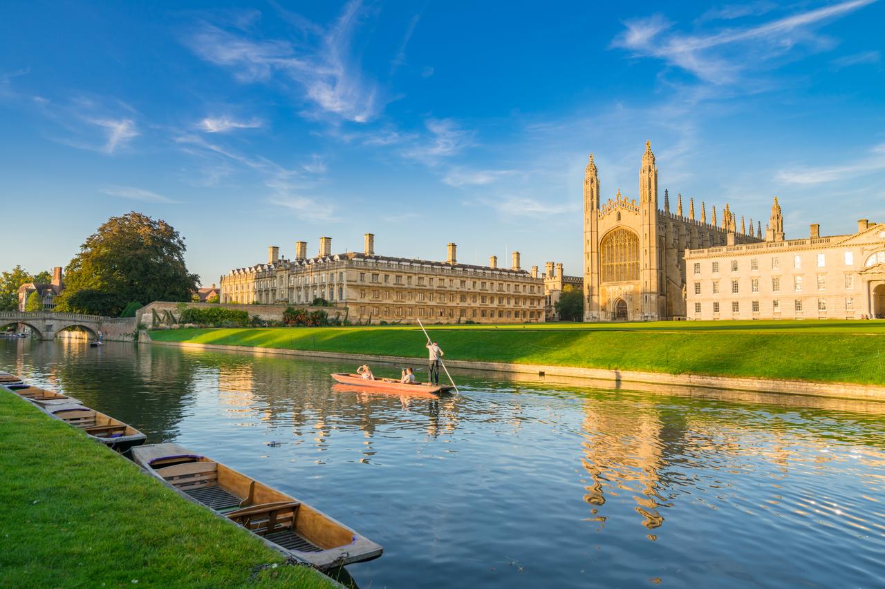 Boats pass along the River Cam beside King’s College in Cambridge, United Kingdom. (Adobe Stock Photo)