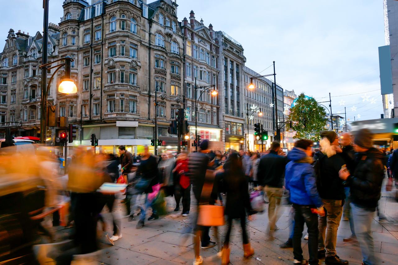 Pedestrians move through a busy shopping street in central London, United Kingdom. (Adobe Stock Photo)