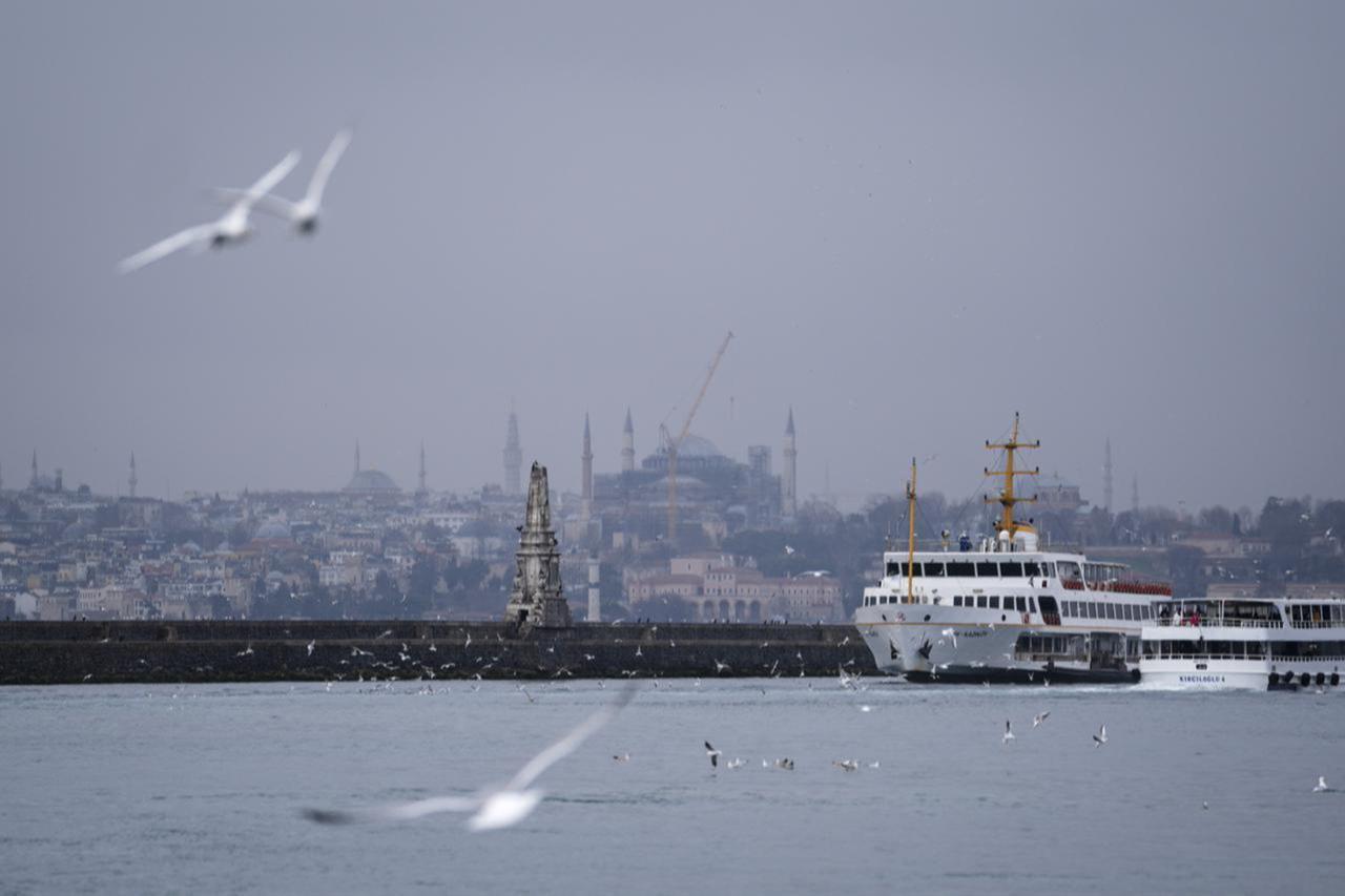 A view of a passenger ferry and a seagull flies over the Bosphorus during a rainy day in Kadikoy district of Istanbul, Türkiye, January 17, 2026. (AA Photo)