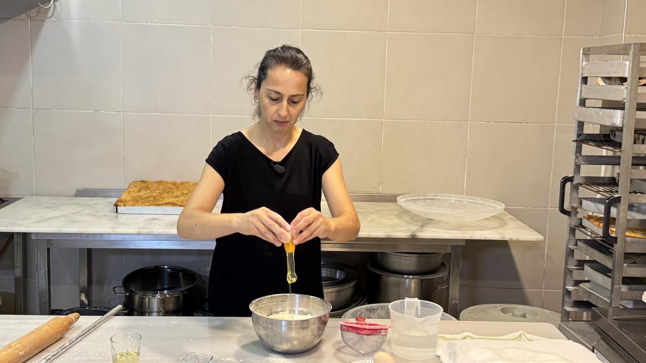 A cooperative member prepares dough ingredients while making traditional Laz boregi in Hopa, Artvin, Türkiye, March 1, 2026. (AA Photo)