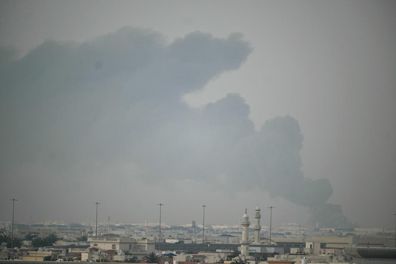 A plume of smoke rises following a reported Iranian strike in Doha on March 1, 2026. (AFP Photo)