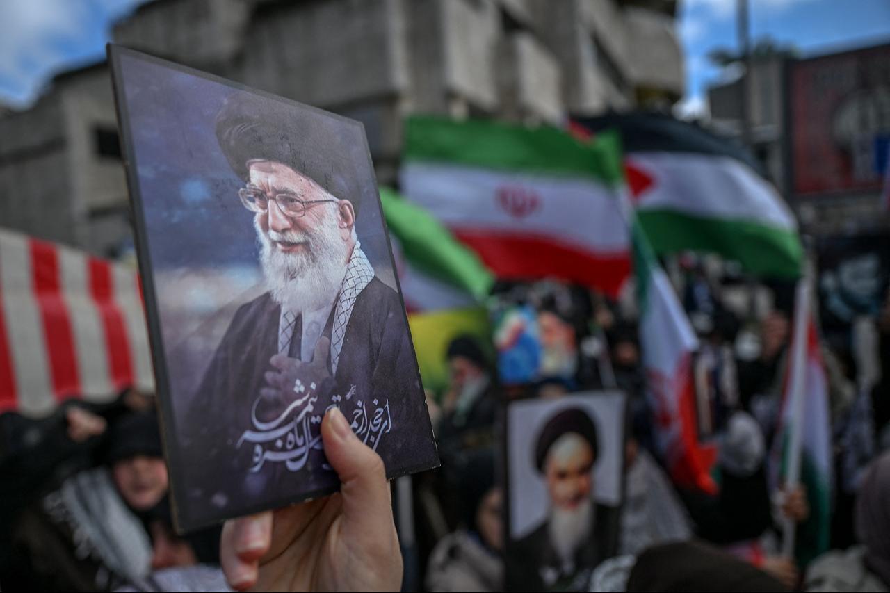 Protestors hold portraits of Iran's late supreme leader Ali Khamenei as they gather to protest against the US and Israel's attack on Iran in front of the Israeli Consulate in Istanbul, March 1, 2026. (AFP Photo)