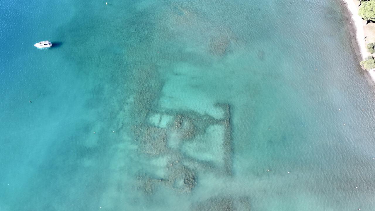 An aerial view of "Kalimce Ruins" remain submerged in the touristic neighborhood of Gocek, in Fethiye, Türkiye has been declared a First-Degree Archaeological Site on Feb. 22, 2026. (AA Photo)