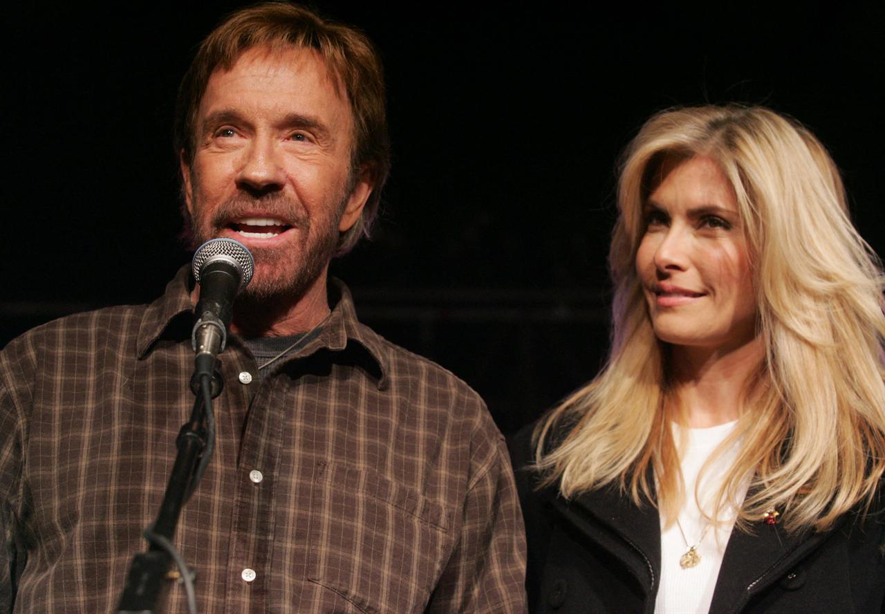 US Actor Chuck Norris and his wife, Gena O'Kelley, speak during a "Huck and Chuck" rally for Republican Presidential hopeful and former Arkansas Governor Mike Huckabee at the Val Air Ballroom in Des Moines, Iowa, January 1, 2008. (AFP File Photo)