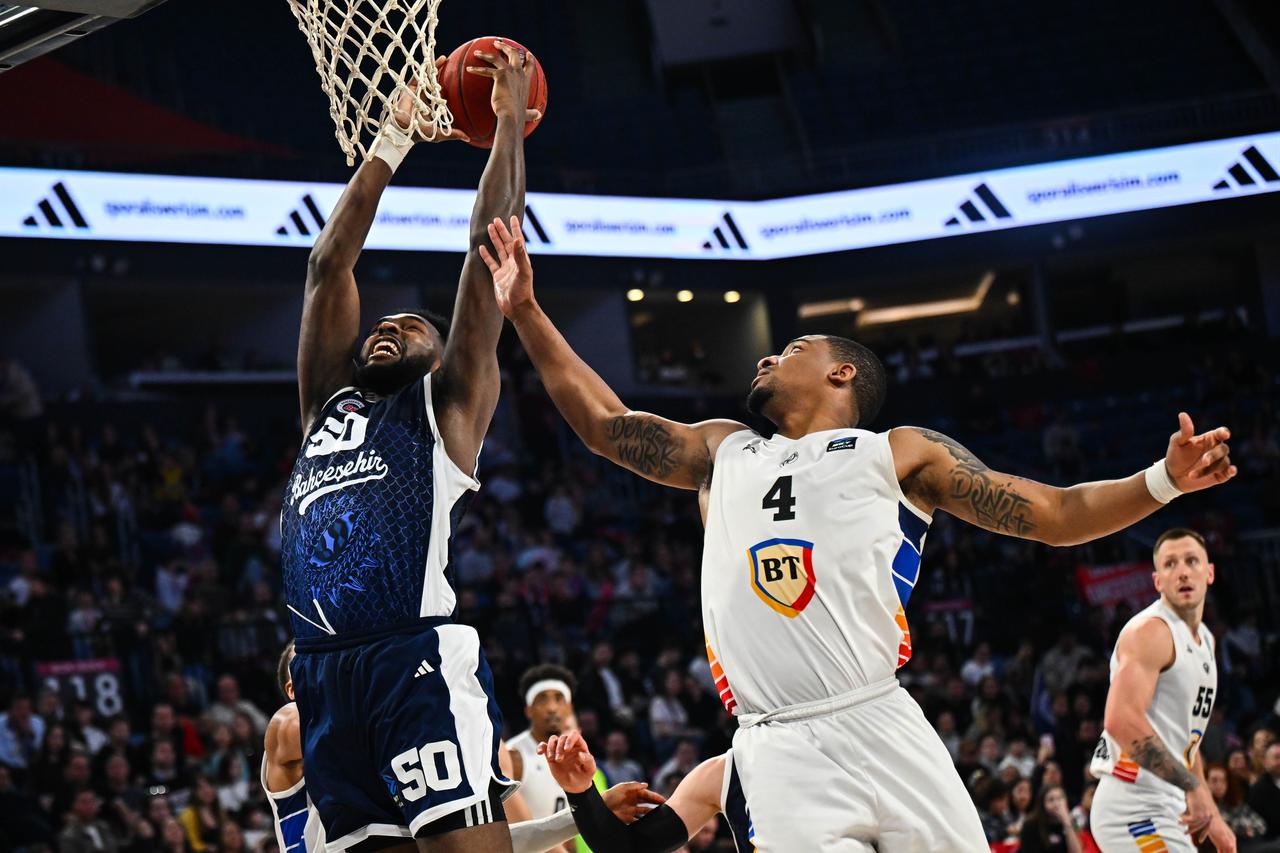 Bahcesehir Koleji’s Trevion Williams (50) and U BT Cluj Napoca’s Nighael Ceaser (4) vie for the ball during the BKT EuroCup quarterfinal at Sinan Erdem Sports Hall in Istanbul, Turkiye, March 17, 2026. (AA Photo)