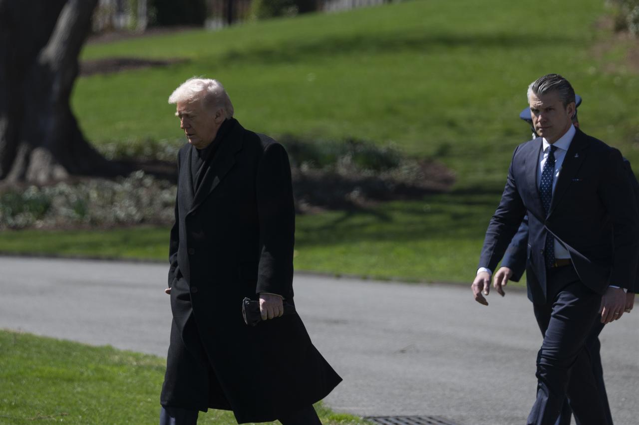 United States President Donald Trump, US Secretary of Defense Pete Hegseth outside the Oval Office of the White House before boarding Marine One, on March 18, 2026, in Washington DC. (AA Photo)