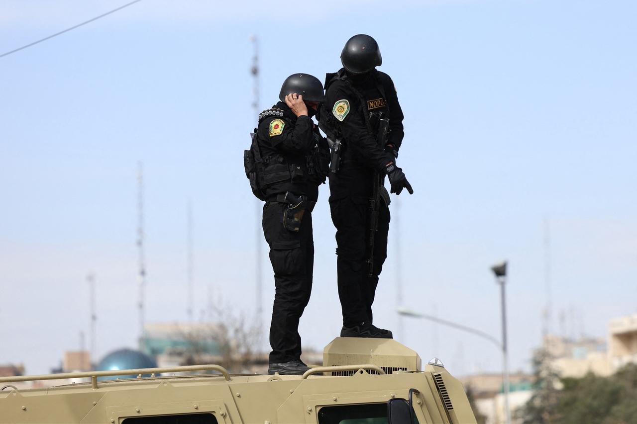 Iranian security forces stand guard on top of an armoured vehicle during the funeral ceremony of Iran's Revolutionary Guards spokesperson Ali Mohammad Naini, who was killed in US-Israeli strikes, in Tehran, Iran on March 21, 2026. (AFP Photo)