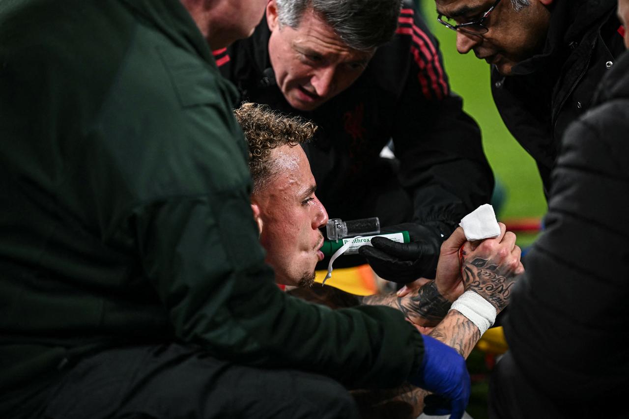 Galatasaray's Dutch forward #77 Noa Lang receives medical attention after cutting his thumb during the UEFA Champions League, round of 16 second leg football match between Liverpool and Galatasaray at Anfield in Liverpool, north-west England on March 18, 2026. (AFP Photo)