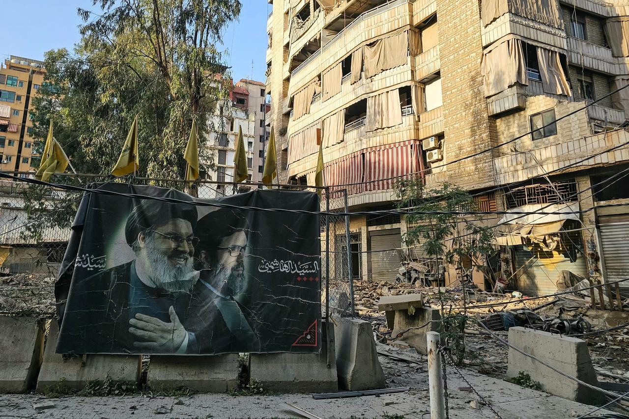 A photograph shows a banner bearing portraits the slain leaders of the Lebanese Shia movement Hezbollah, Hassan Nasrallah (L) and Hashem Safieddine, in Beirut’s southern suburbs, Lebanon on March 18, 2026. (AFP Photo)