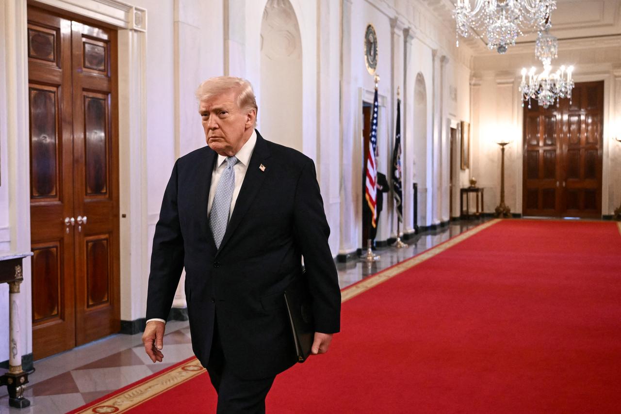 US President Donald Trump walks through the Cross Hall as he arrives for a ceremony in the East Room of the White House in Washington, DC, on March 20, 2026. (AFP Photo)