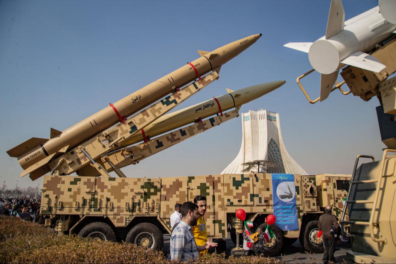 Missiles and UAVs are shown to people on the side of the road in Tehran, Iran, February 11, 2024. (AFP Photo)