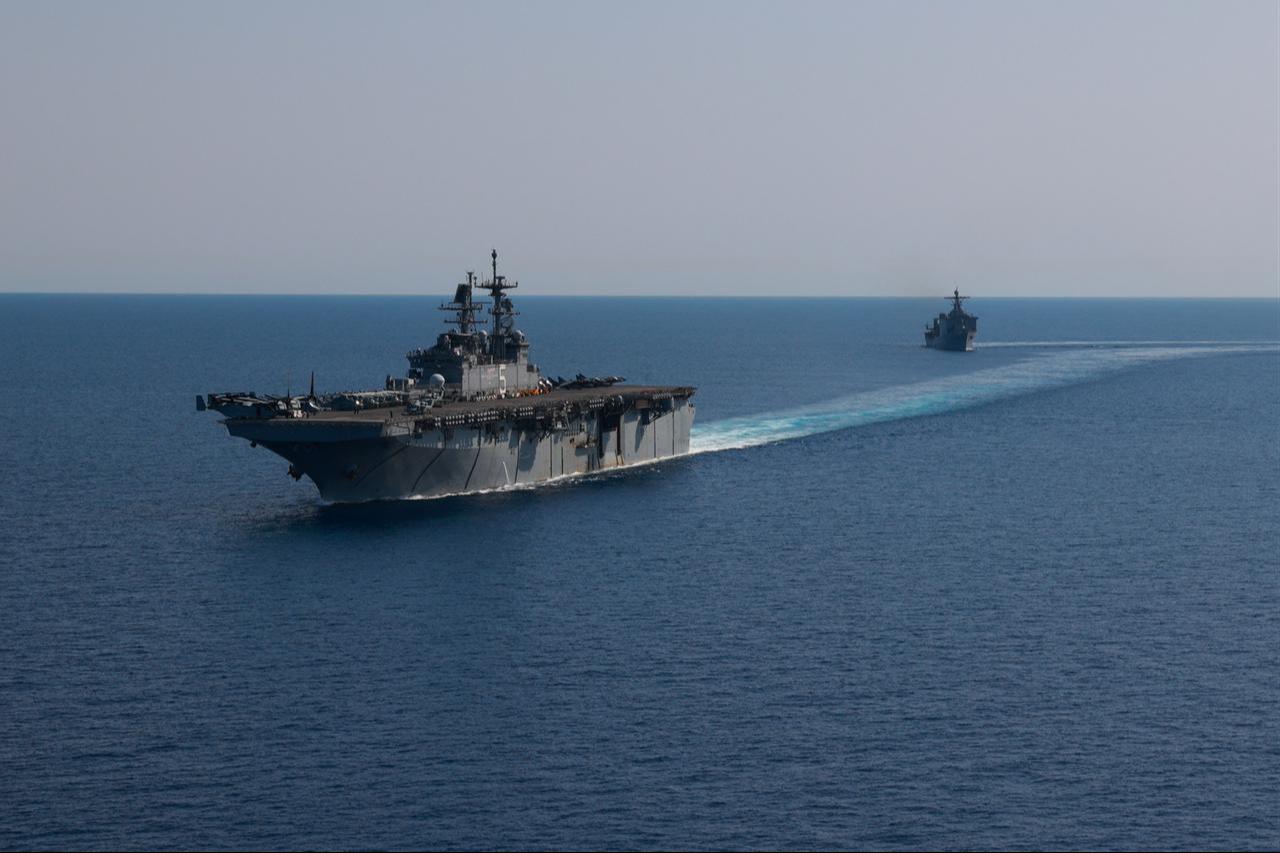 Amphibious assault ship USS Bataan (LHD 5) and Dock landing ship USS Carter Hall (LSD 50) transit in formation through the Red Sea, Aug. 8, 2023. (Photo via U.S. Navy)