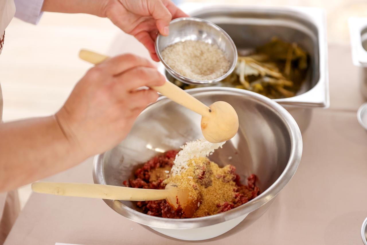 Ingredients including minced meat, rice, fine bulgur and spices are mixed to prepare Konya-style meat-stuffed vine leaves in Konya, Türkiye, March 20, 2026. (AA Photo)