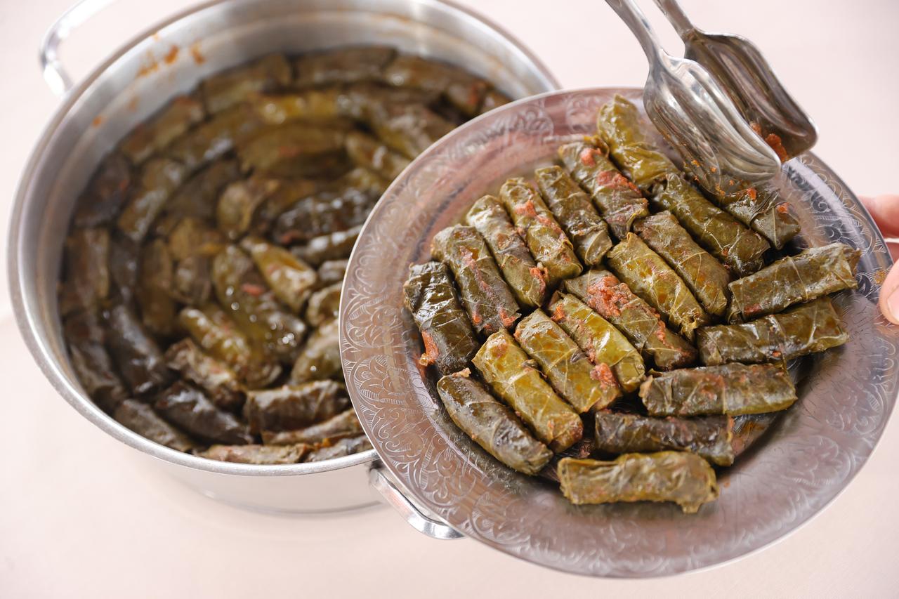 Meat-stuffed vine leaves, a signature dish of Konya cuisine, are served on a plate in Konya, Türkiye, March 20, 2026. (AA Photo)