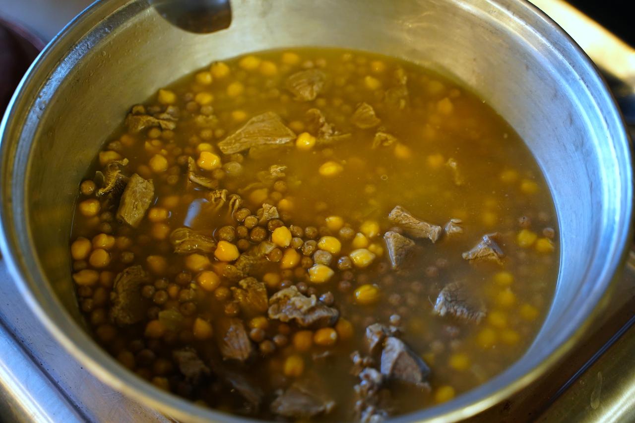 Meat and chickpeas are cooked together as the base of yuvalama, a traditional dish in Türkiye, March 22, 2026. (AA Photo)