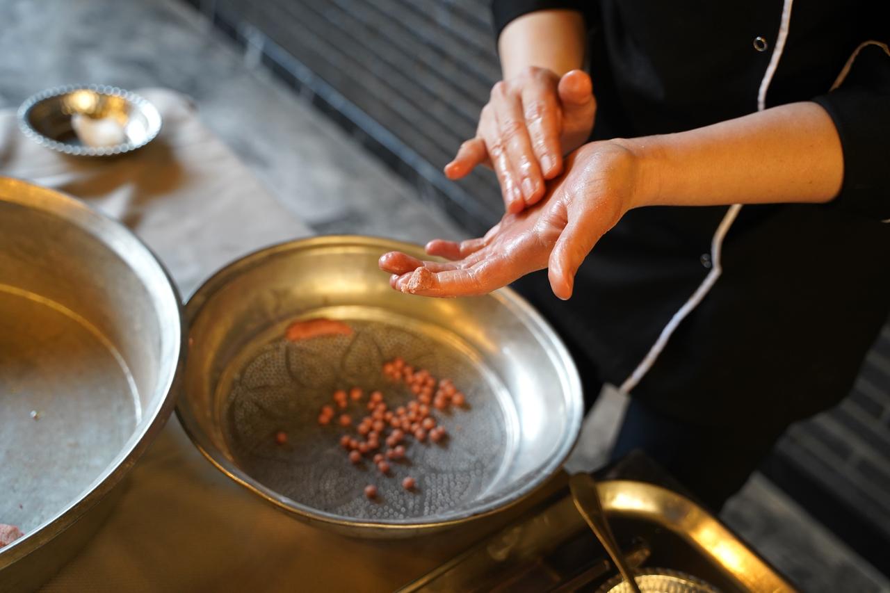 Small rice-based meatballs are shaped by hand as part of the traditional preparation of yuvalama in Türkiye, March 22, 2026. (AA Photo)