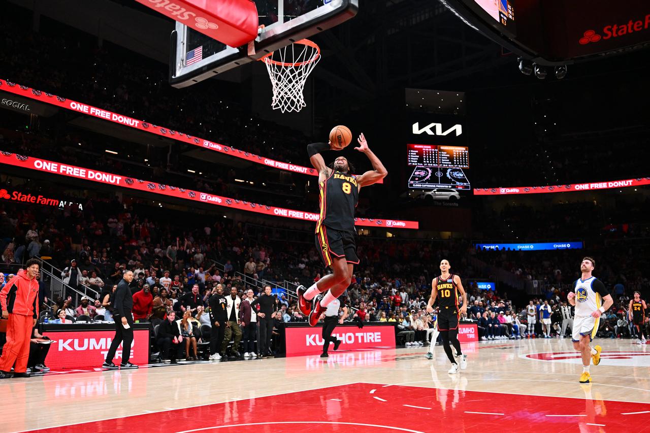 Buddy Hield #8 of the Atlanta Hawks dunks the ball during the game against the Golden State Warriors at State Farm Arena in Atlanta, Georgia, US, March 21, 2026. (AFP Photo)