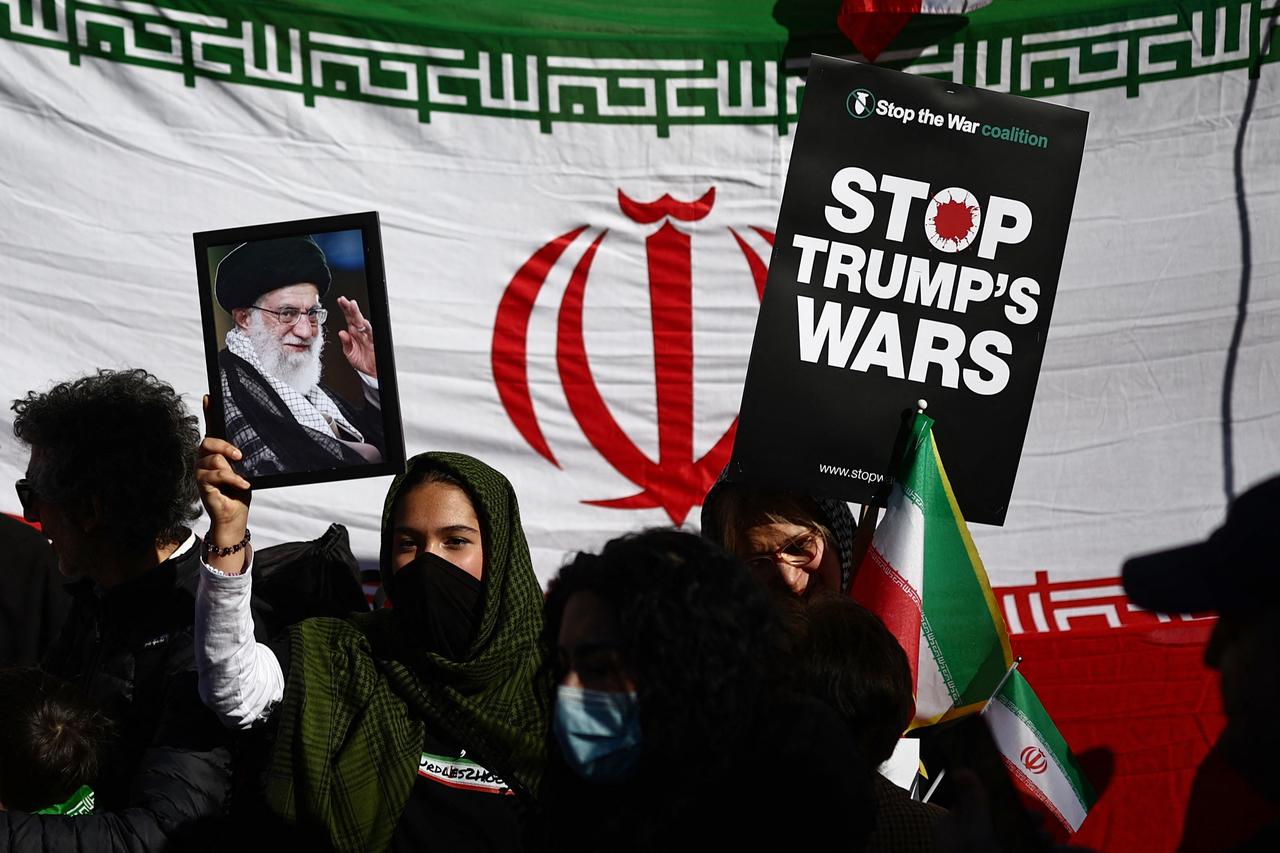 A picture of Iran's former Supreme Leader Ali Khamenei is held during a protest march in central London on March 21, 2026, calling for the bombing of Iran to stop. (AFP Photo)