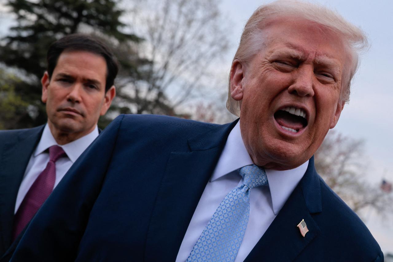 U.S. President Donald Trump speaks to reporters as he and Secretary of State Marco Rubio (L) depart the White House on their way to Florida on March 20, 2026, in Washington, DC. (AFP Photo)
