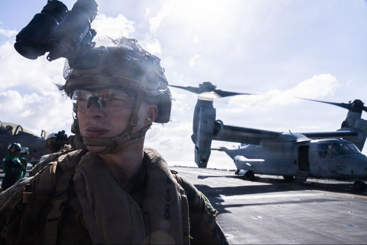 A U.S. Marine coffloads an MV-22B Osprey aboard the forward-deployed amphibious assault carrier USS Tripoli (LHA 7), Dec. 14, 2025. (Photo via U.S. Marine Corps)