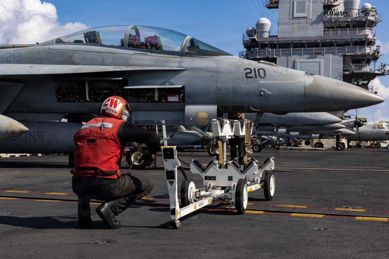 A U.S. Sailor performs a visual inspection on an F/A-18F Super Hornet aircraft on the flight deck of the USS Gerald R. Ford (CVN 78) in support of Operation Epic Fury in the Eastern Mediterranean Sea, March 2, 2026. (Photo via U.S. Navy)