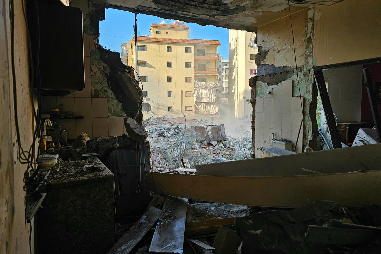 Destruction is seen at the site of an overnight Israeli airstrike that targeted the Burj al-Barajneh neighbourhood in the southern suburbs of the Lebanese capital Beirut on March 24, 2026. (AFP Photo)