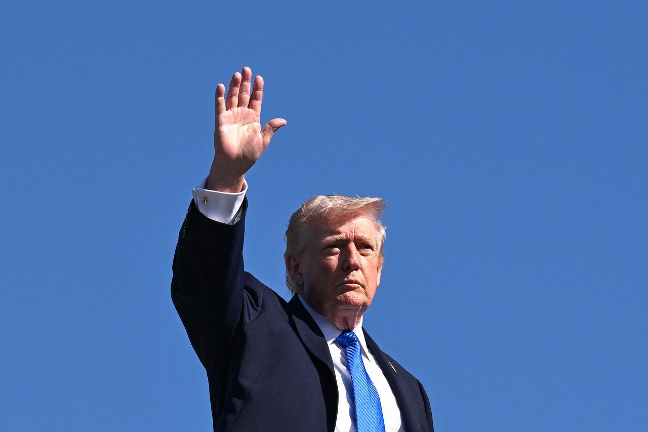 U.S. President Donald Trump boards Air Force One at Palm Beach International Airport on March 23, 2026 in West Palm Beach, Florida. (AFP Photo)