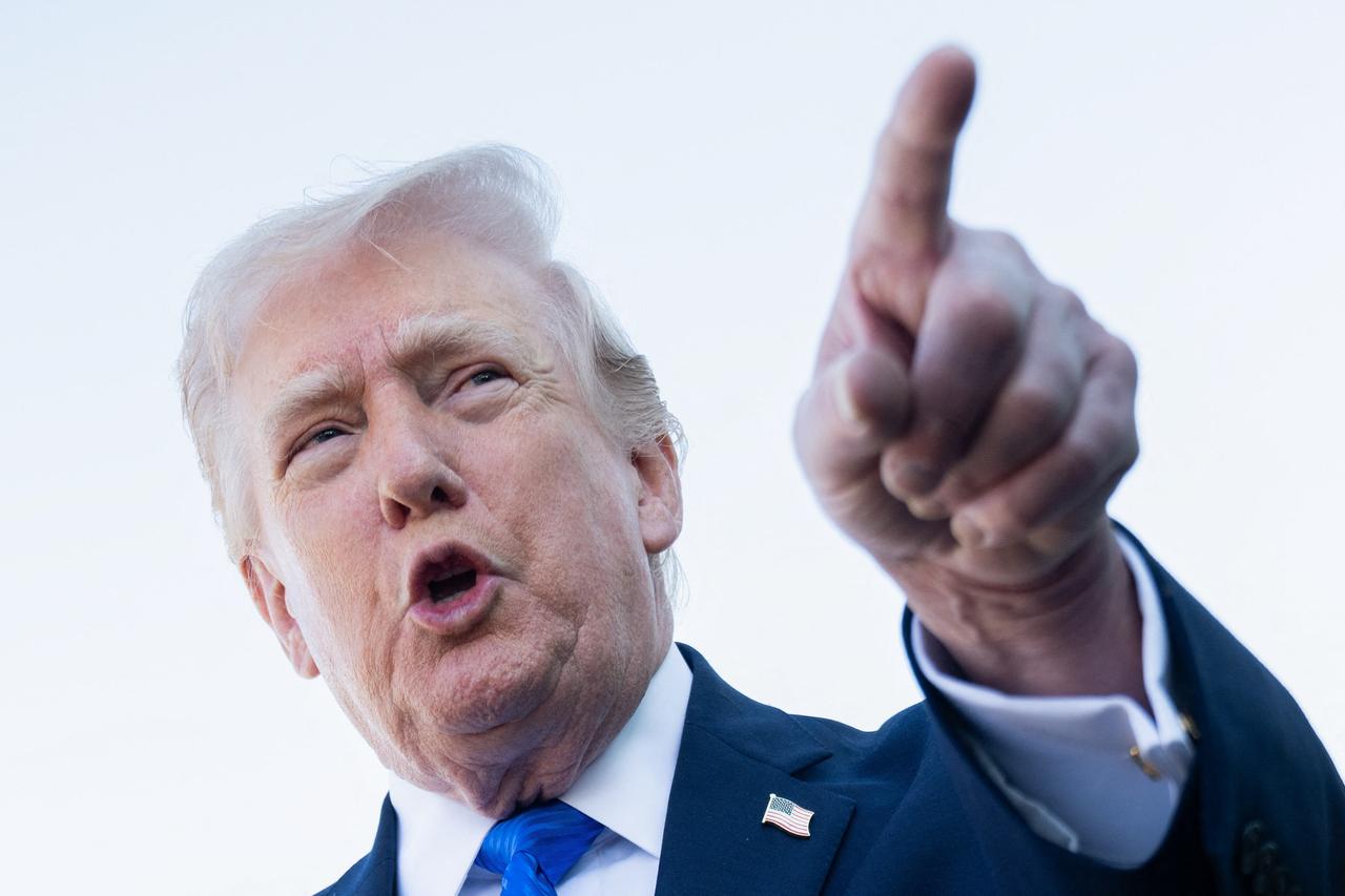 US President Donald Trump speaks to reporters before boarding Air Force One at Palm Beach International Airport in West Palm Beach, Florida, March 23, 2026. (AFP Photo)