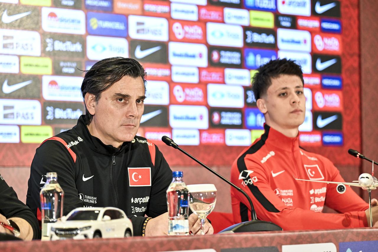 Turkish National Football Team head coach Vincenzo Montella (left) and player Arda Guler (right) speak at a press conference held at the Turkish Football Federation (TFF) Hasan Dogan National Teams Camp and Training Facility in Istanbul, Türkiye, March 25, 2026. (AA Photo)