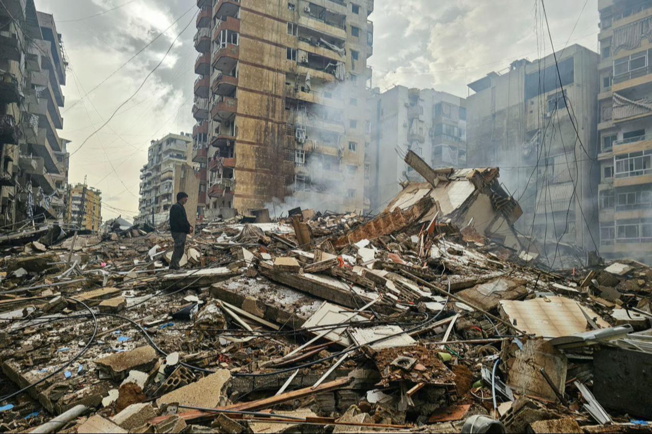A man stands on the rubble of a destroyed building at the site of an overnight Israeli airstrike that targeted the Haret Hreik neighbourhood of Beirut’s southern suburbs, Lebanon on March 14, 2026. (AFP Photo)
