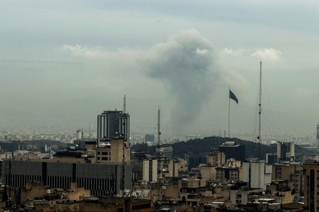 A plume of smoke rises from the site of a strike in Tehran, Iran on March 16, 2026. (AFP Photo)