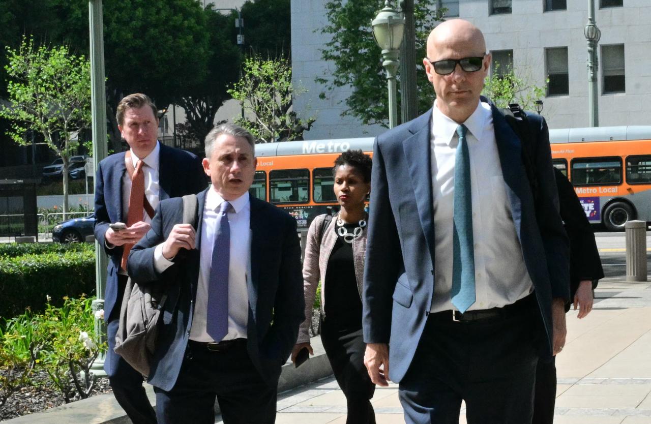 Attorneys Phyllis Jones (2L), Paul Schmidt (R) representing Meta, arrive at the Los Angeles Superior Court, United States, March 23, 2026. (AFP Photo)