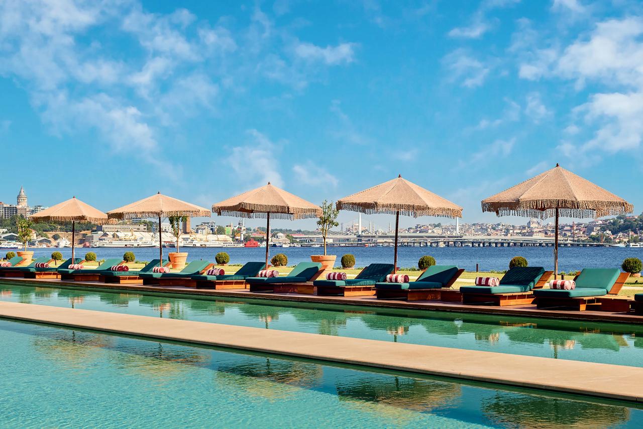 Aliée Istanbul’s waterfront pool area overlooks the Golden Horn, highlighting the hotel’s connection to Istanbul’s historic shoreline. (Photo via TIME)