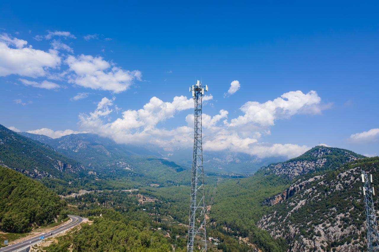 A 5G cellular antenna tower stands in the mountains of southern Türkiye. (Adobe Stock Photo)