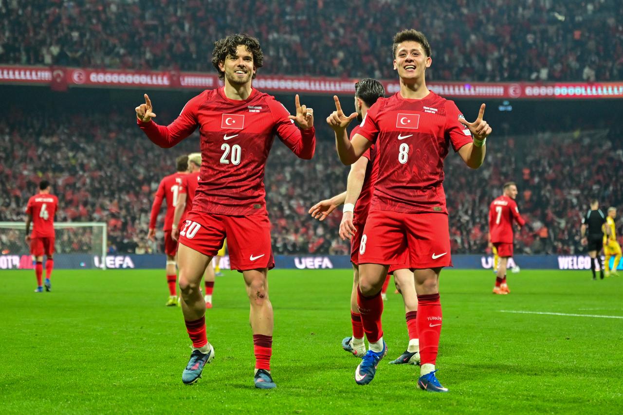 Turkish national team players Ferdi Kadioglu (20) celebrated his goal with teammate Arda Guler (8) at Tupras Stadium, Istanbul, Türkiye, March 26, 2026. (AA Photo)