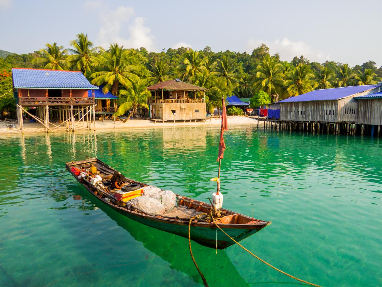 Traditional wooden fishing boat moored in the turquoise waters of Sok San Village, Preah Sihanouk province, Cambodia, accessed on March 27, 2026. (Adobe Stock Photo)