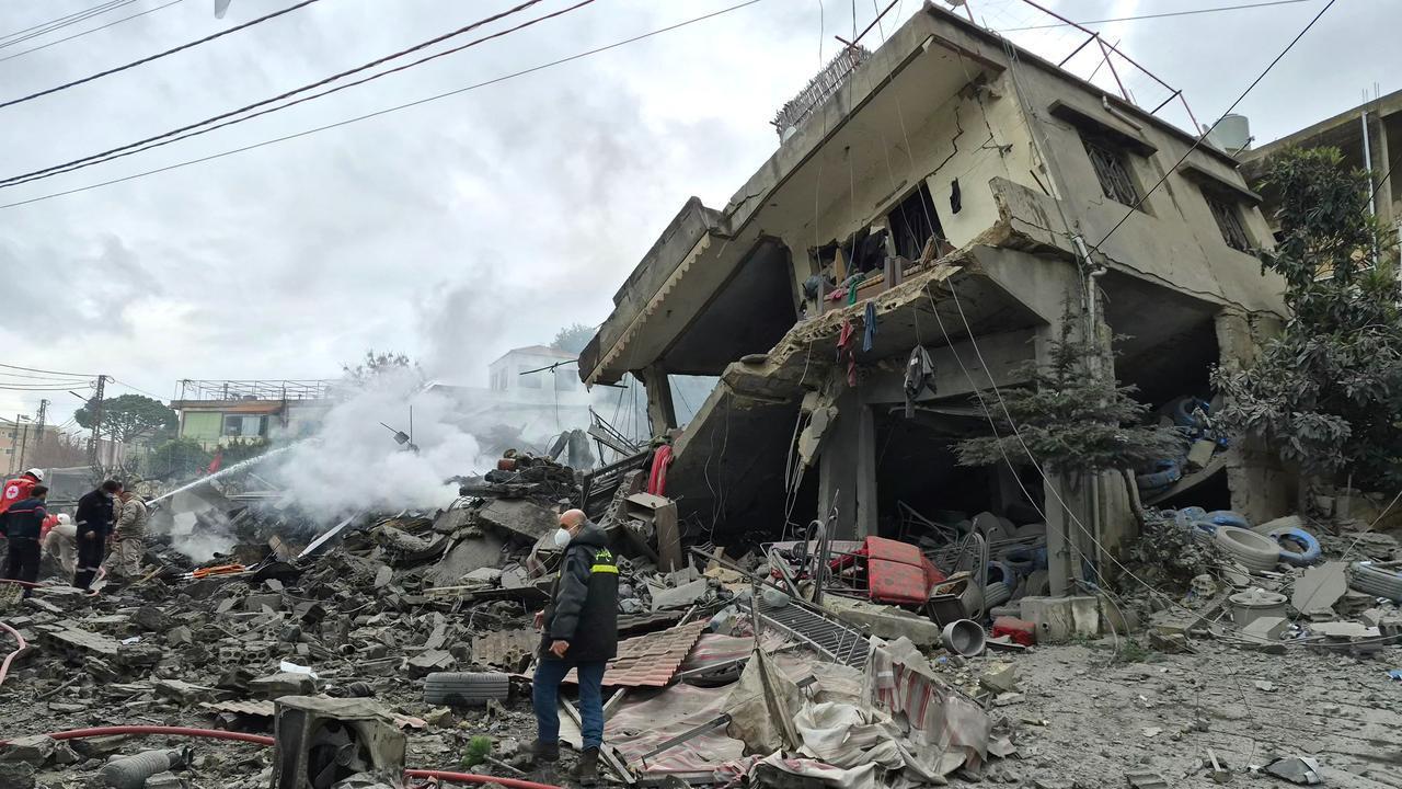 First aid responders are seen at the site of an Israeli airstrike that targeted the southern Lebanese village of Kfar Roummane on March 26, 2026. (AFP Photo)