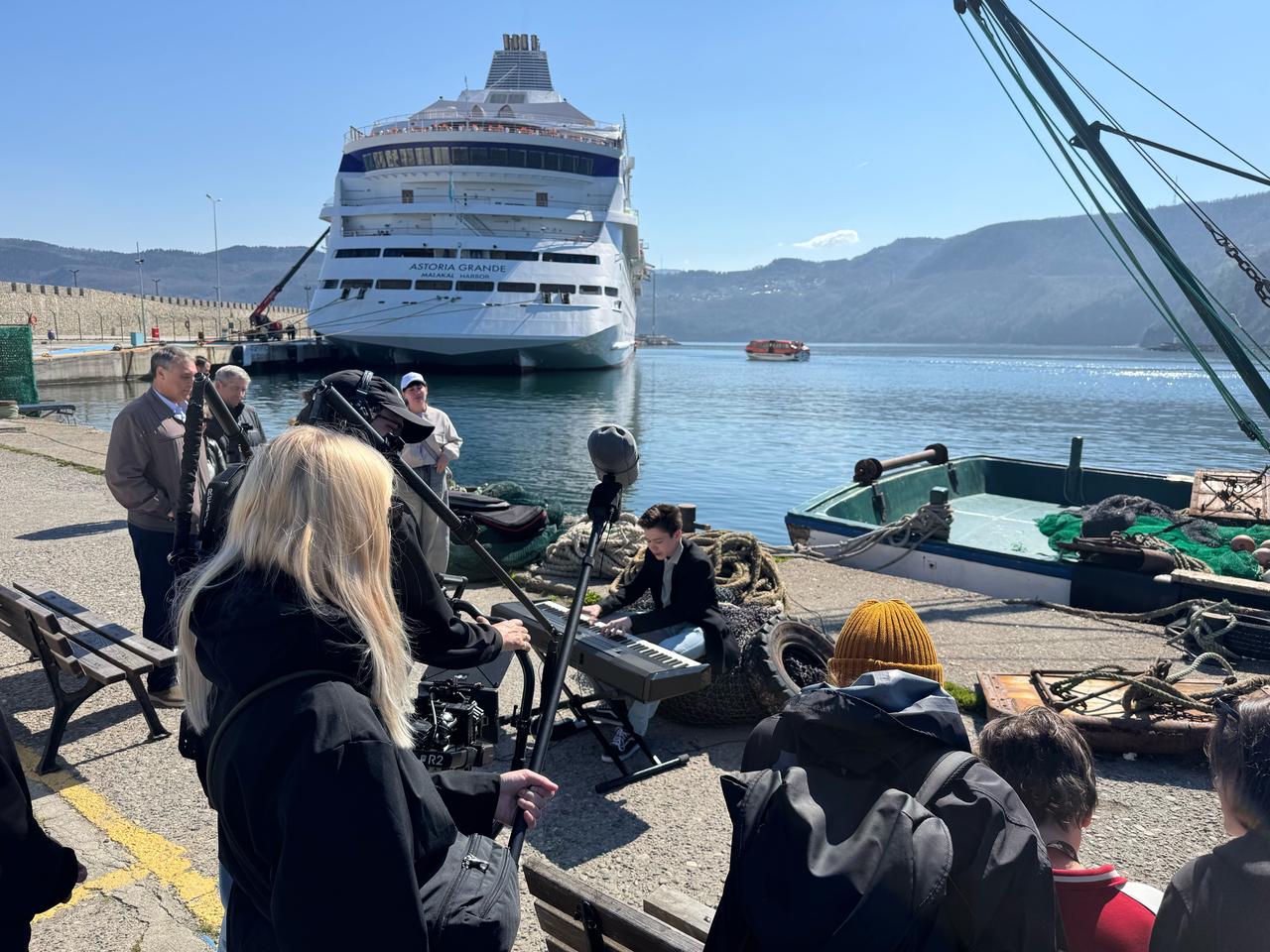 Crew members film a scene by the waterfront as the cruise ship Astoria Grande docks in Amasra during production of a Russian film in Bartin, Türkiye. (AA Photo)