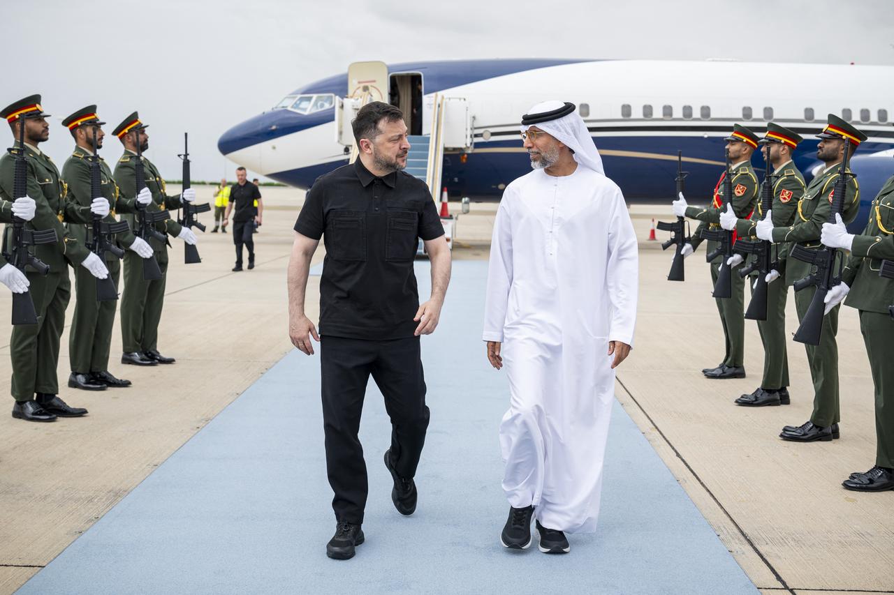 An undated handout photograph released on March 28, 2026, by the United Arab Emirates Presidential Court shows UAE's Energy Minister Suhail Mohamed al-Mazrouei (R) welcoming Ukrainian President Volodymyr Zelensky up his arrival in the United Arab Emirates. (United Arab Emirates Presidential Court /AFP Photo)