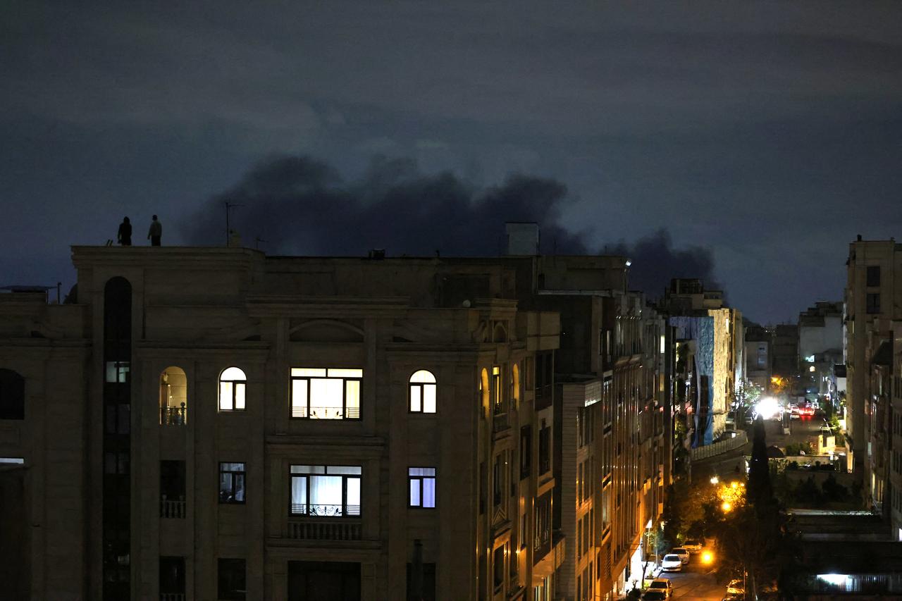 A plume of smoke rises from the site of a strike in Tehran, Iran early on March 28, 2026. (AFP Photo)