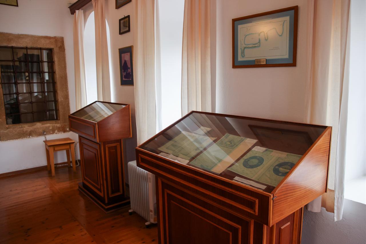 Close-up of manuscript display cases preserving historical documents within the Hafiz Ahmed Agha Library. (AA Photo)