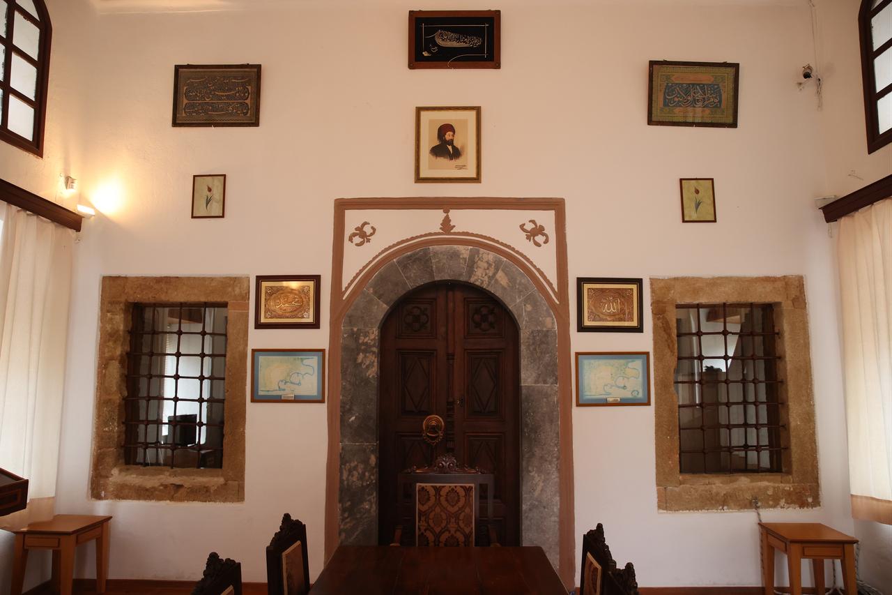 Interior view of the Hafiz Ahmed Agha Library in Rhodes, featuring Ottoman-era calligraphy and traditional architectural details. (AA Photo)
