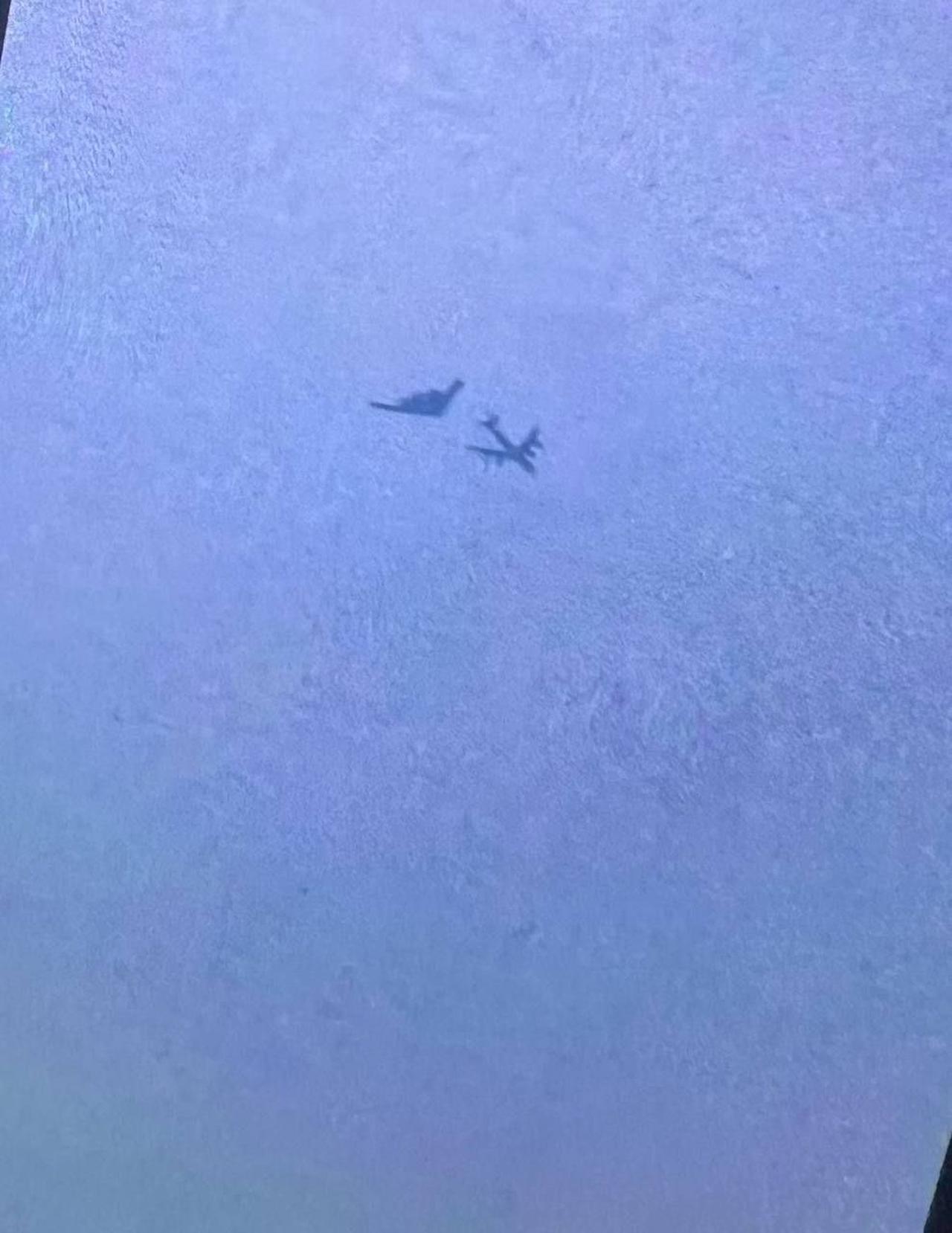 The photo allegedly shows a USAF B-2 Spirit bomber and a KC-135 refueling aircraft on March 26, 2026, near Tabriz, northwestern Iran. (Photo via Telegram)