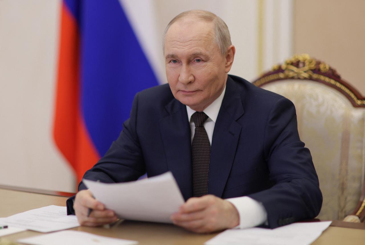 Russia's President Vladimir Putin takes part via videoconference from Moscow on March 27, 2026, in the opening ceremony of the Azerbaijan Musical and Drama Theater held in Derbent. (AFP Photo)