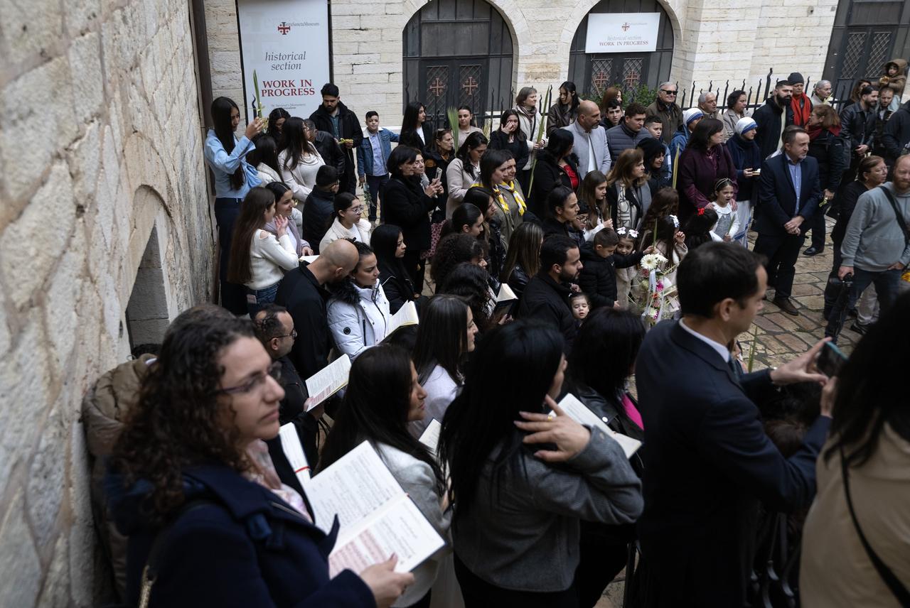 Christians attend the service at Monastery of Saint Saviour to celebrate the feast of ‘Palm Sunday’, one of the most important holidays of the Christian world, known as the memory of Christ's triumphal entry into Jerusalem in East Jerusalem on March 29, 2026. (AA Photo)