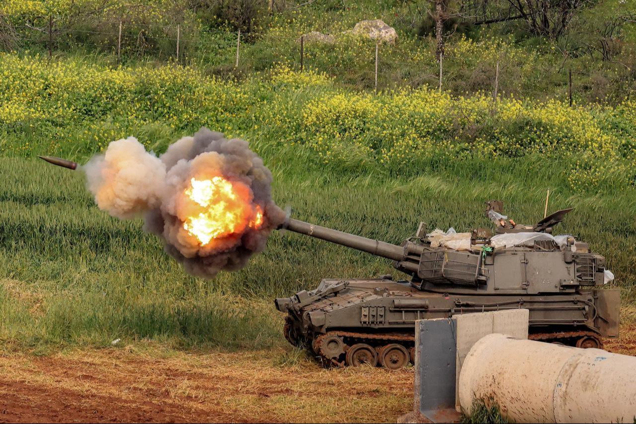 An Israeli self-propelled howitzer artillery gun fires rounds towards southern Lebanon from a position in the upper Galilee in northern Israel near the border, March 26, 2026. (AFP Photo)