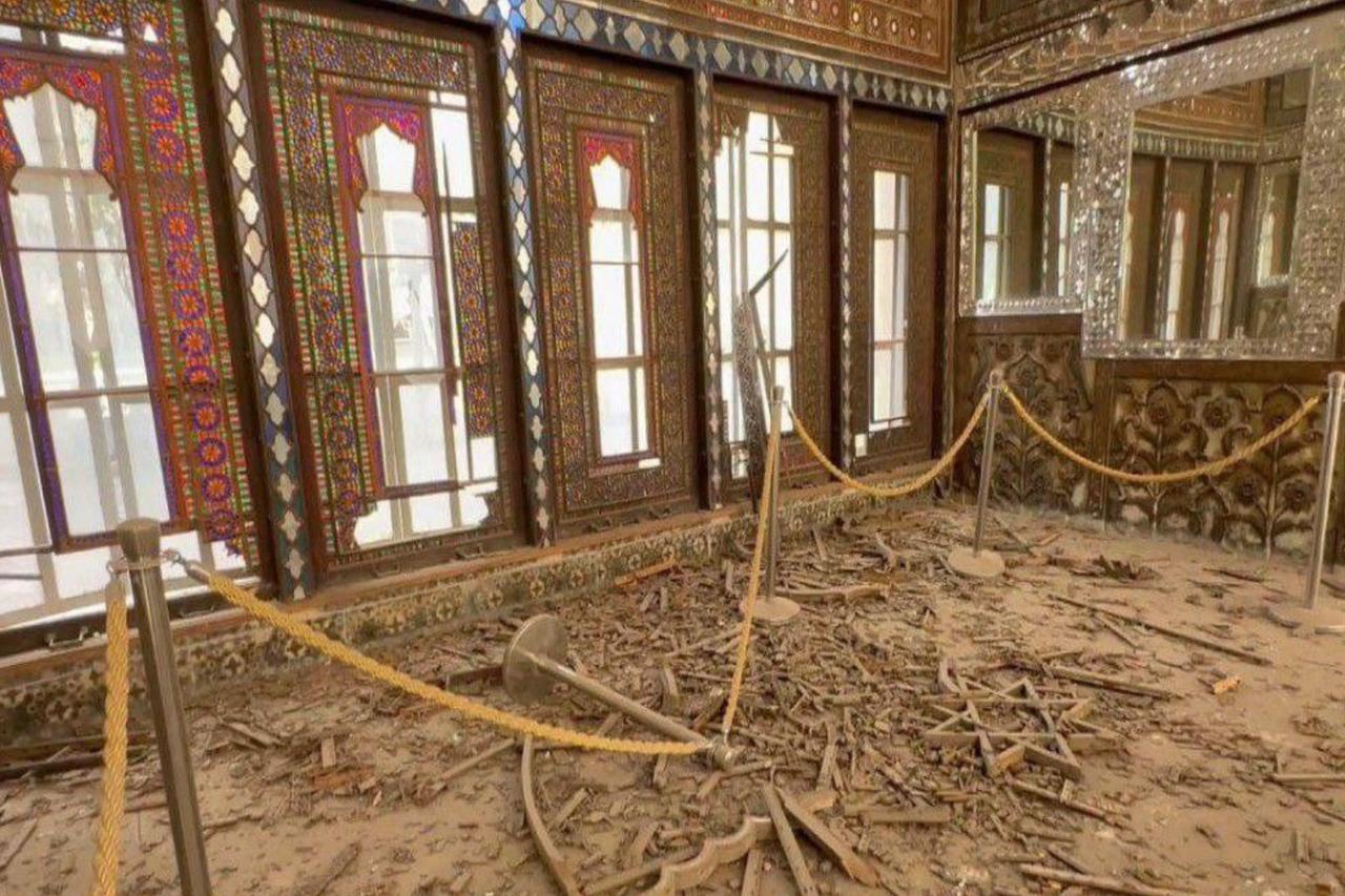 Debris and shattered glass cover the floor inside Golestan Palace after blast waves from an airstrike in central Tehran, Iran. (Photo via WANA)