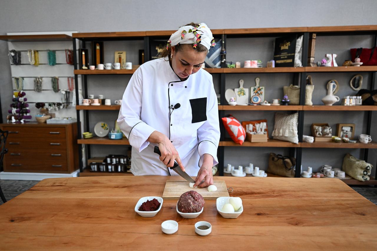 Ingredients including minced meat, onions, pepper paste and spices are prepared for Adana icli kofte in Adana, Türkiye, March 3, 2026. (AA Photo)