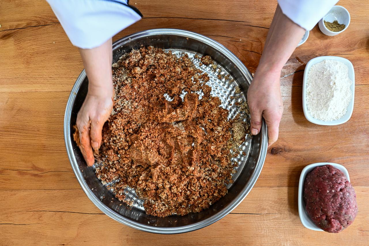 Ingredients including minced meat, onions, pepper paste and spices are prepared for Adana icli kofte in Adana, Türkiye, March 3, 2026. (AA Photo)